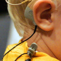 Can a completely deaf person use hearing aids?