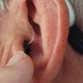 How long should you wear hearing aids in a day?