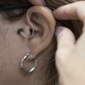 Why hearing aids are not covered by insurance?